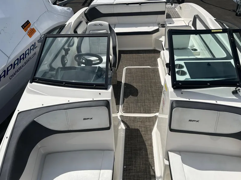Slide: The Image of 2016 Sea Ray 21 SPX OB boat interior with seating and steering wheel. - 5