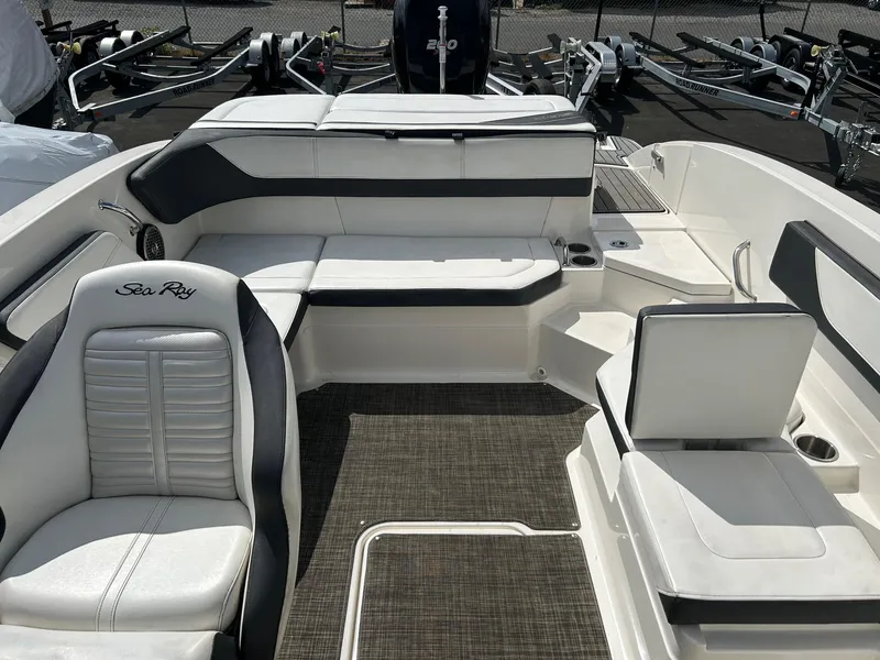 Slide: The Image of 2016 Sea Ray 21 SPX OB boat interior with white seating and black accents. - 7