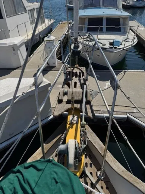 Slide: The Image of Sailboat docked at marina, Baba 30 model, 1978, with visible bow and rigging. - 27