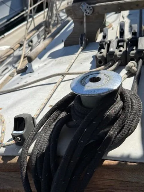 Slide: The Image of Deck of 1978 Baba 30 sailboat with ropes and winch. - 7