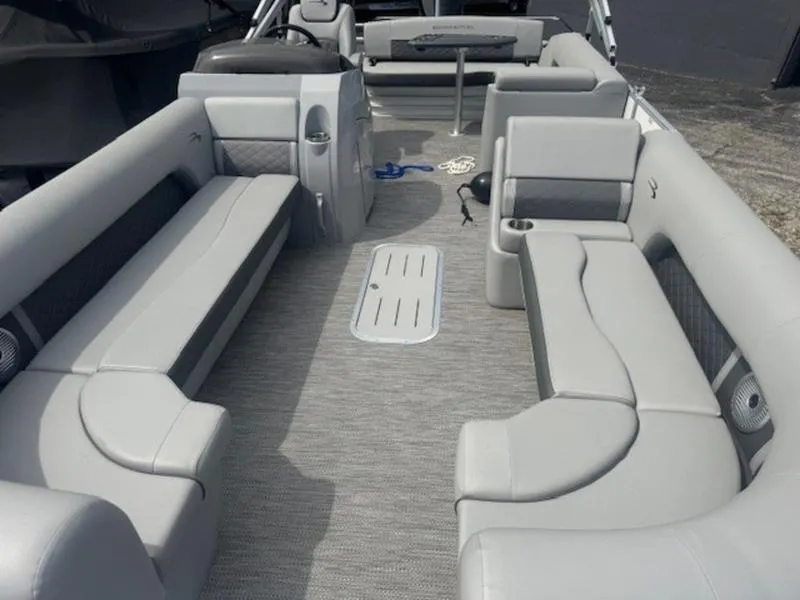 Slide: The Image of 2025 Bennington L Bowrider Swingback 25 LTSB interior with spacious seating and modern design. - 12