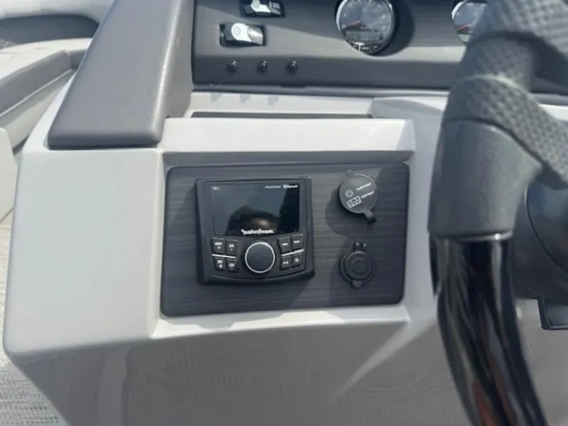 Slide: The Image of Dashboard of 2025 Bennington L Bowrider Swingback 25 LTSB with audio controls. - 4