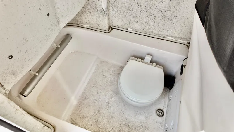 Slide: The Image of 2023 Sea Fox 248 Commander boat interior with compact marine toilet. - 10