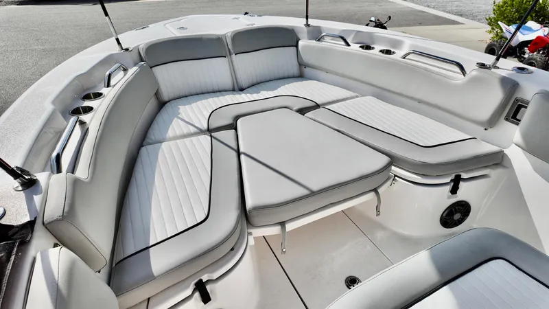 Slide: The Image of 2023 Sea Fox 248 Commander boat interior with cushioned seating and cup holders. - 15