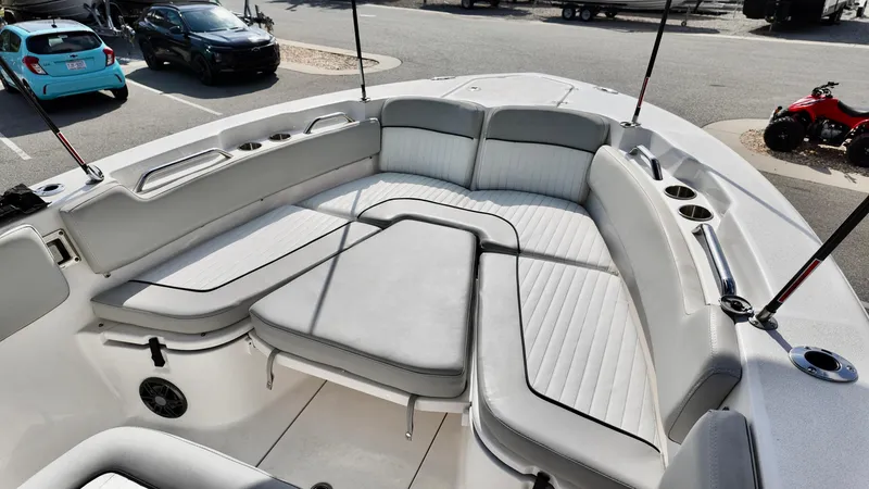 Slide: The Image of 2023 Sea Fox 248 Commander boat interior with cushioned seating and cup holders. - 17