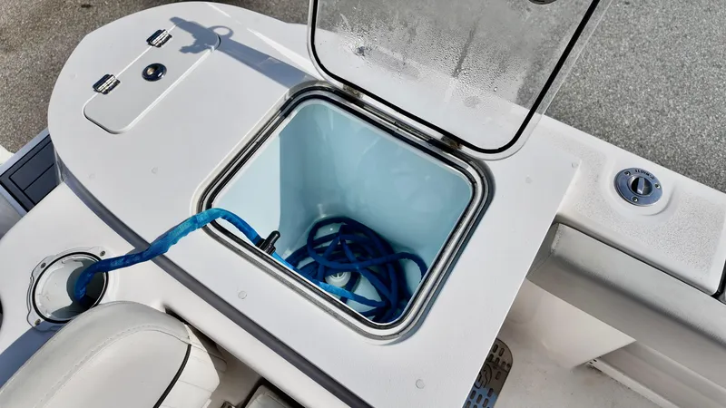 Slide: The Image of 2023 Sea Fox 248 Commander boat storage compartment with blue rope inside. - 7