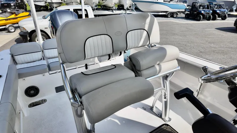 Slide: The Image of 2023 Sea Fox 248 Commander boat interior with cushioned seating and steering wheel. - 8
