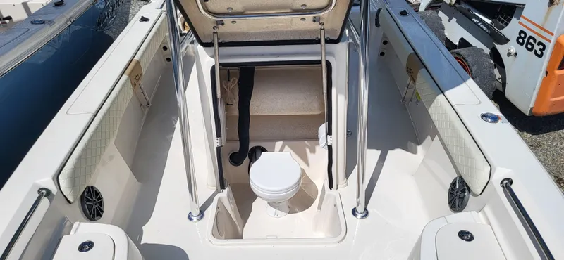 Slide: The Image of 2023 Sea Chaser 23 LX boat interior with open hatch and visible toilet. - 10