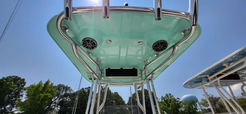 Slide: The Image of 2023 Sea Chaser 23 LX boat with teal canopy and stainless steel frame. - 15