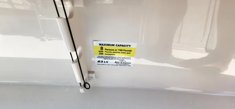 Slide: The Image of 2023 Sea Chaser 23 LX boat capacity label, showing maximum capacity and specifications. - 4