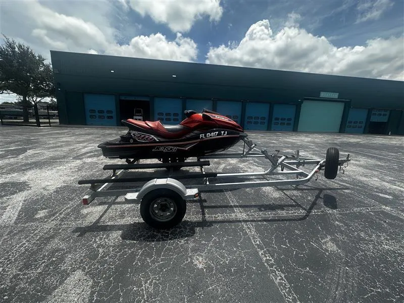 Slide: The Image of 2015 Kawasaki Jet Ski Ultra 310X SE on trailer, parked in front of blue garage doors. - 3
