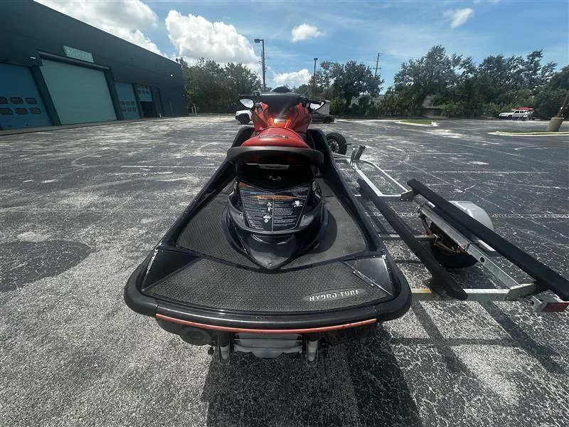 Slide: The Image of 2015 Kawasaki Jet Ski Ultra 310X SE on trailer in parking lot. - 4