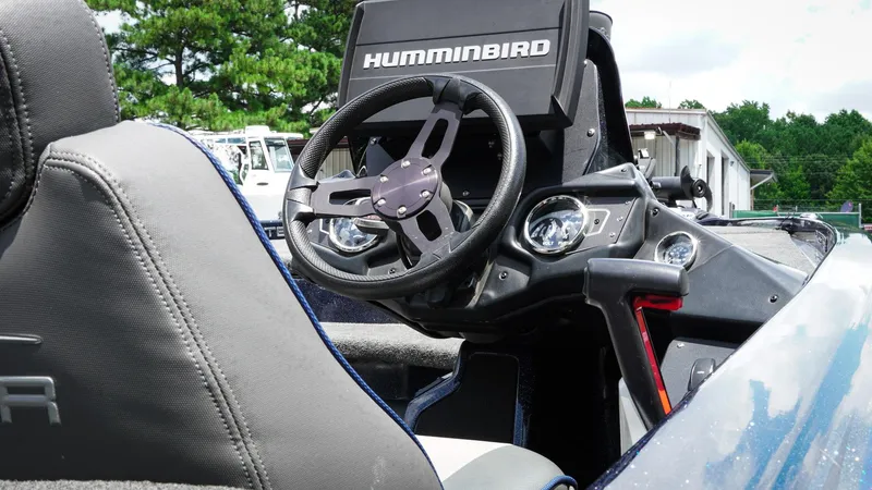 Slide: The Image of 2020 Skeeter ZX225 boat dashboard with Humminbird electronics and steering wheel. - 10
