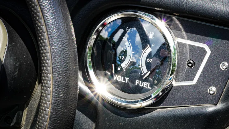 Slide: The Image of Close-up of 2020 Skeeter ZX225 dashboard showing volt and fuel gauges. - 12