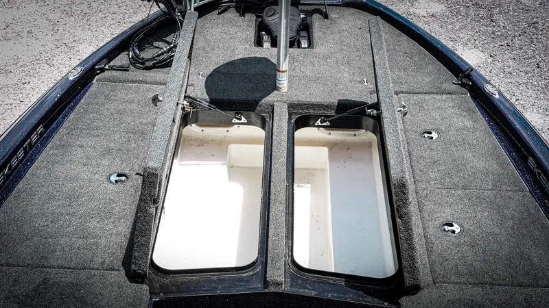 Slide: The Image of 2020 Skeeter ZX225 boat deck with open storage compartments, showcasing spacious interior. - 13