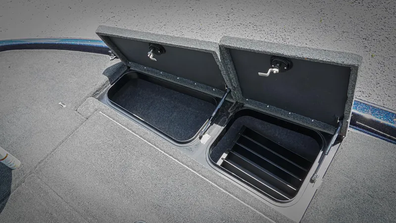 Slide: The Image of 2020 Skeeter ZX225 boat storage compartments with open lids, showcasing interior space. - 15