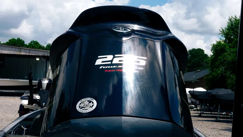 Slide: The Image of 2020 Skeeter ZX225 boat engine with "225 Four Stroke" label, outdoors under cloudy sky. - 19