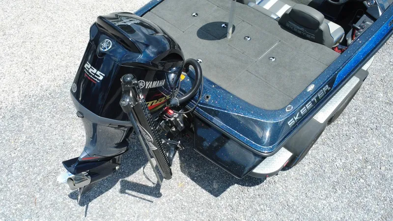 Slide: The Image of 2020 Skeeter ZX225 boat with Yamaha 225 engine, rear view on pavement. - 7