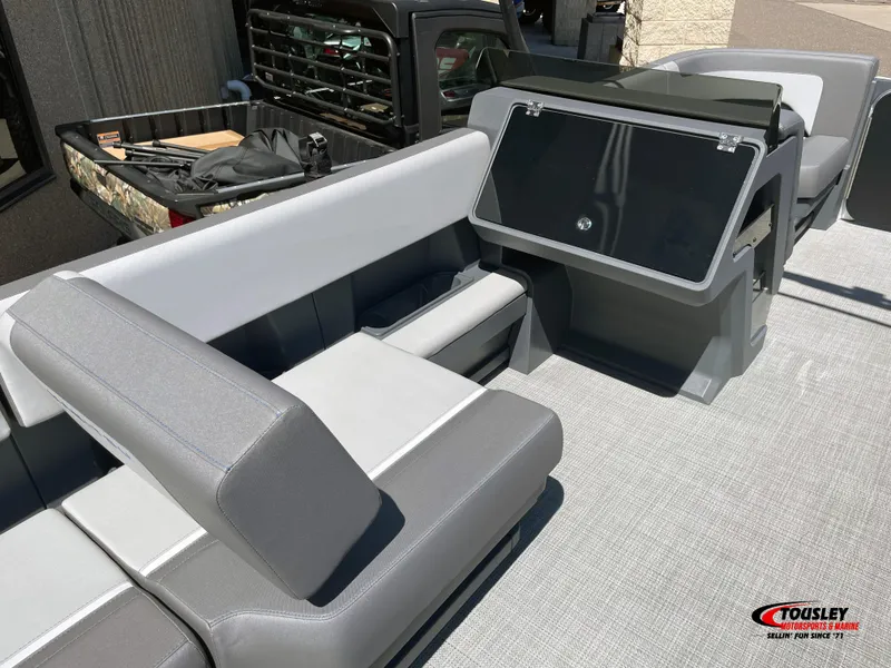 Slide: The Image of 2025 Manitou Cruise 22 Switchback Twin Tube interior with modern seating and console design. - 12