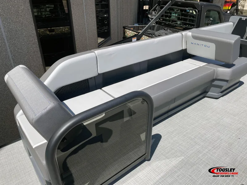 Slide: The Image of 2025 Manitou Cruise 22 Switchback Twin Tube pontoon boat with sleek seating design. - 4