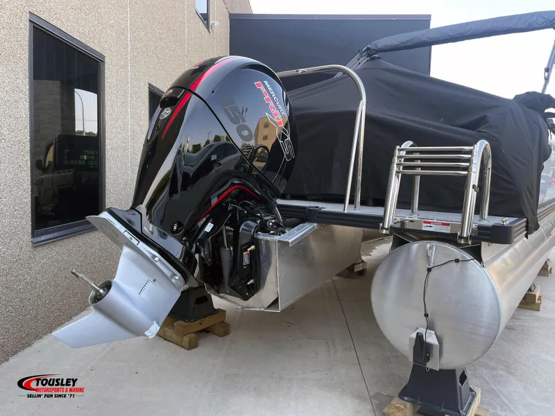 Slide: The Image of 2025 Manitou Cruise 22 Switchback Twin Tube pontoon boat with powerful outboard motor. - 7