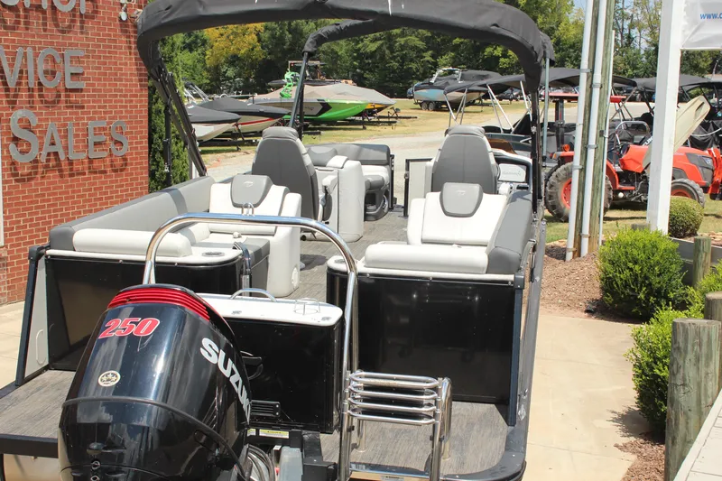Slide: The Image of 2023 Tahoe CASCADE boat with Suzuki 250 engine at dealership, showcasing luxury seating and design. - 4