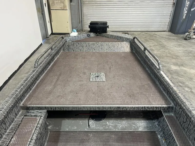 Slide: The Image of 2025 Gator Tail 1750 Savage Mid Deck boat in a garage setting. - 11