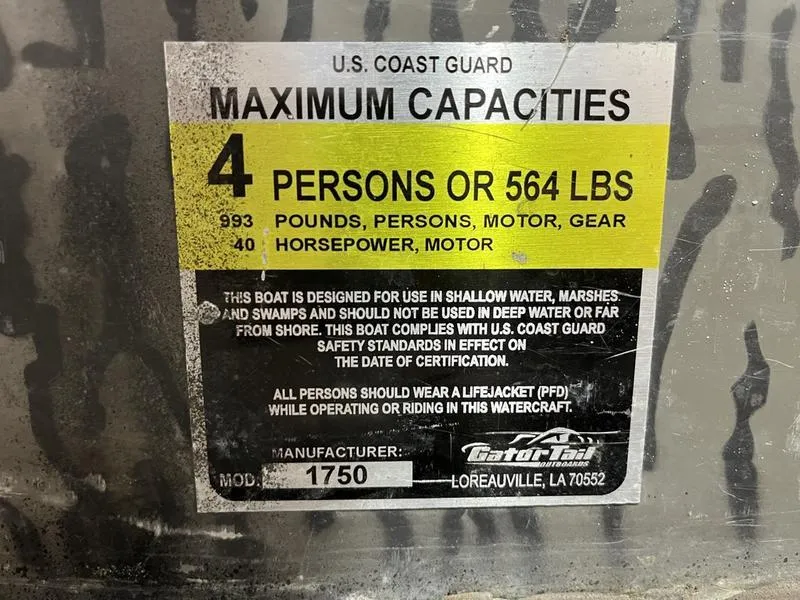 Slide: The Image of 2025 Gator Tail 1750 Savage Mid Deck capacity label, 4 persons or 564 lbs, 40 horsepower. - 12