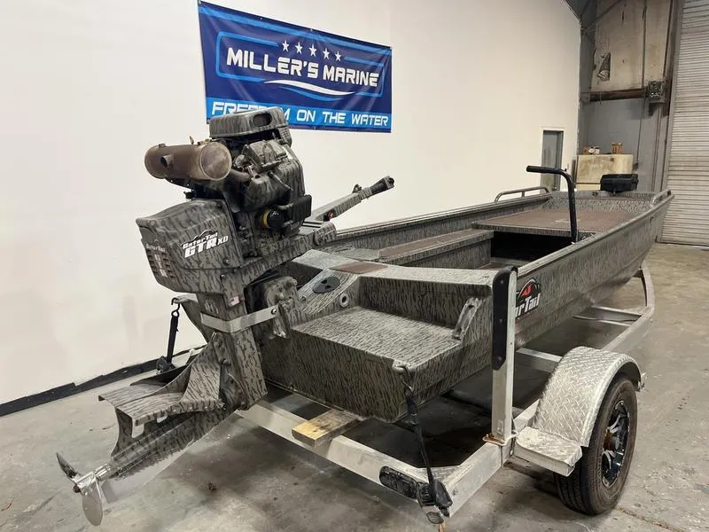 Slide: The Image of 2025 Gator Tail 1750 Savage Mid Deck boat on trailer in showroom. - 3