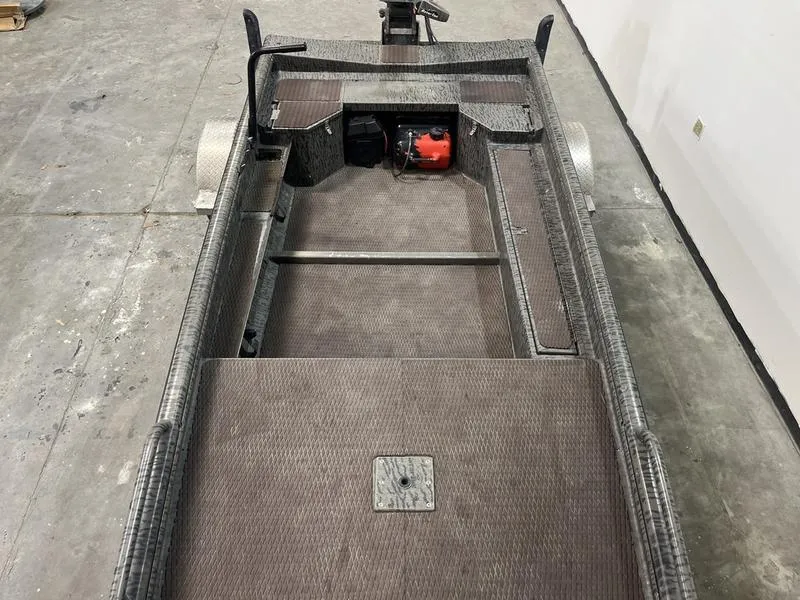 Slide: The Image of 2025 Gator Tail 1750 Savage Mid Deck boat interior, featuring spacious layout and storage compartments. - 6