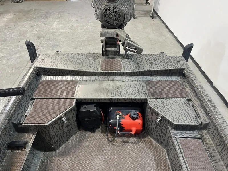 Slide: The Image of 2025 Gator Tail 1750 Savage Mid Deck boat interior with equipment and storage compartments. - 7