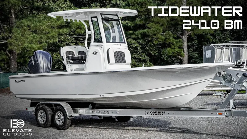 The Image of 2026 Tidewater 2410 Bay Max boat on trailer, displayed outdoors. - 0