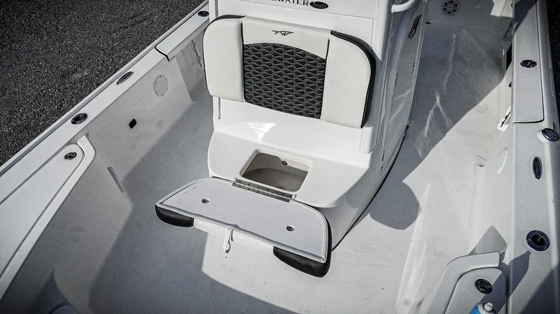 Slide: The Image of 2026 Tidewater 2410 Bay Max boat interior with seating and storage compartment. - 16
