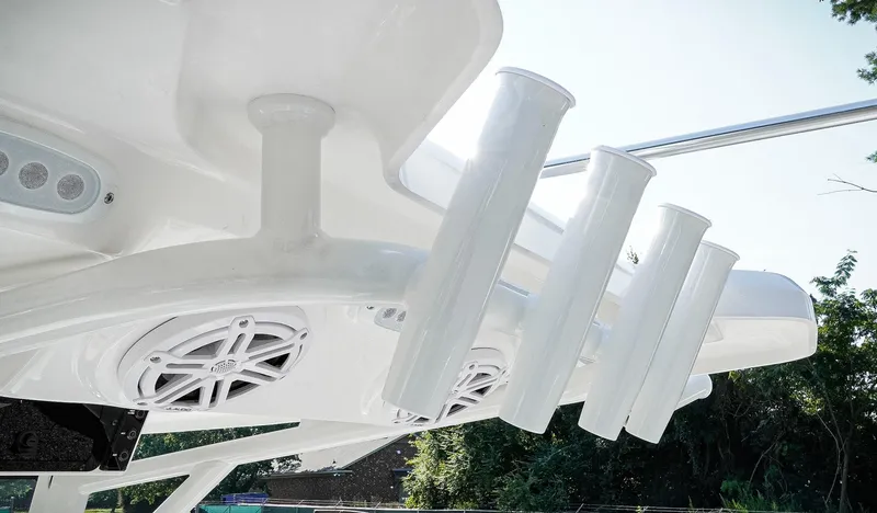 Slide: The Image of 2026 Tidewater 2410 Bay Max boat with rod holders and speakers on the T-top. - 37