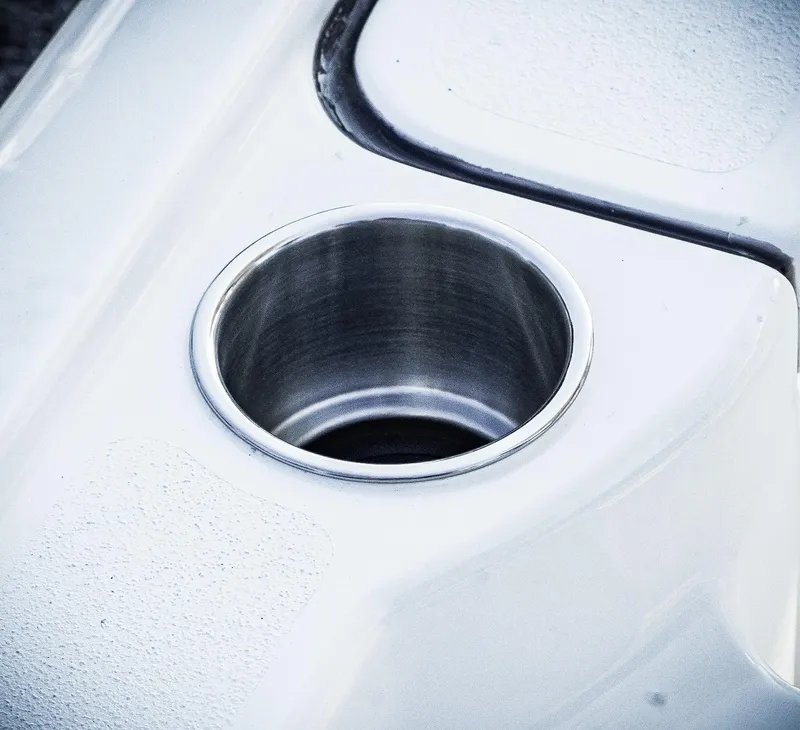Slide: The Image of Close-up of a stainless steel cup holder on a 2026 Tidewater 2410 Bay Max boat. - 38