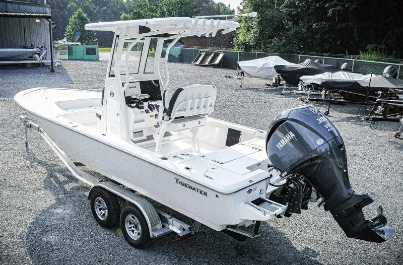 Slide: The Image of 2026 Tidewater 2410 Bay Max boat with Yamaha engine on trailer in outdoor setting. - 4