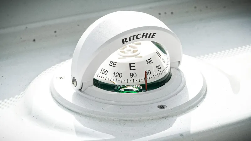 Slide: The Image of Compass on 2026 Tidewater 2410 Bay Max boat, displaying cardinal directions. - 48