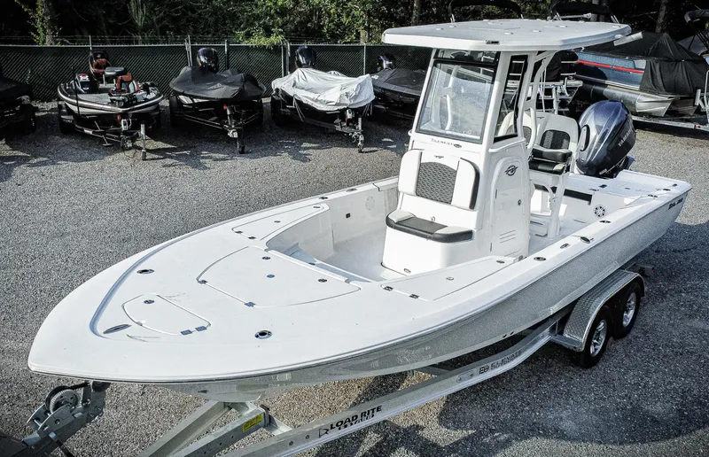 Slide: The Image of 2026 Tidewater 2410 Bay Max boat on trailer, parked in a lot. - 5
