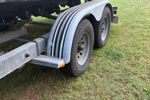 Slide: The Image of Trailer for 1977 Aquasport 222 boat on grass. - 4