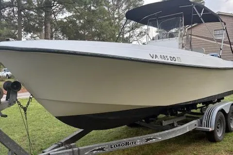 Slide: The Image of 1977 Aquasport 222 boat on Load Rite trailer, parked on grass. - 5