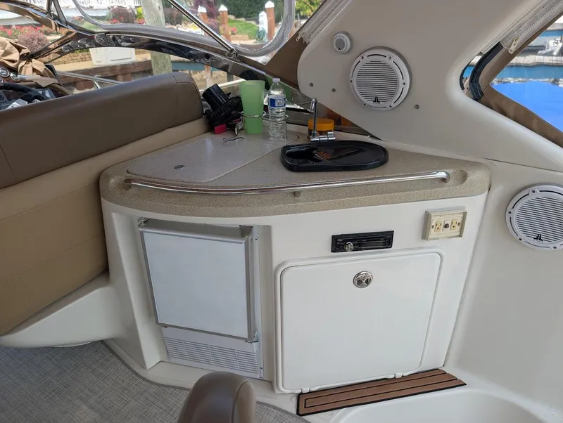 Slide: The Image of 2002 Regal Commodore 3860 yacht interior with kitchenette and seating area. - 14