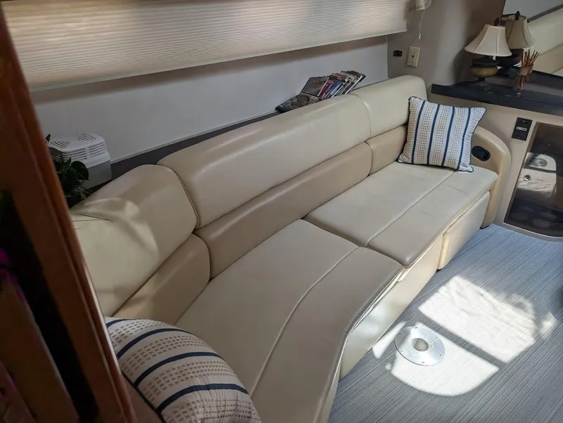 Slide: The Image of Luxurious interior of 2002 Regal Commodore 3860 yacht with beige leather seating. - 23
