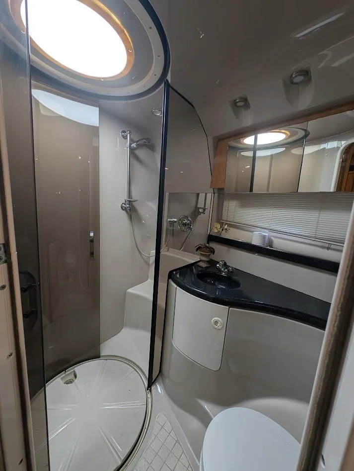Slide: The Image of Luxurious bathroom in 2002 Regal Commodore 3860 yacht with shower and vanity. - 33