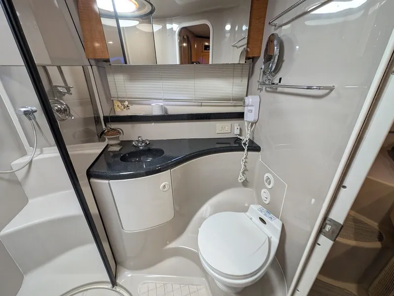 Slide: The Image of Luxurious bathroom in 2002 Regal Commodore 3860 yacht with modern fixtures and sleek design. - 34