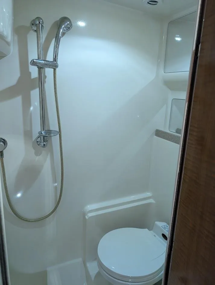 Slide: The Image of Bathroom interior of 2002 Regal Commodore 3860 yacht with shower and toilet. - 39