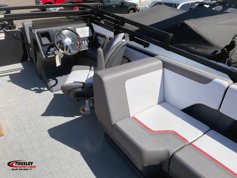Slide: The Image of 2025 Manitou Cruise 20 MAX Bench Twin Tube interior with steering wheel and seating. - 4