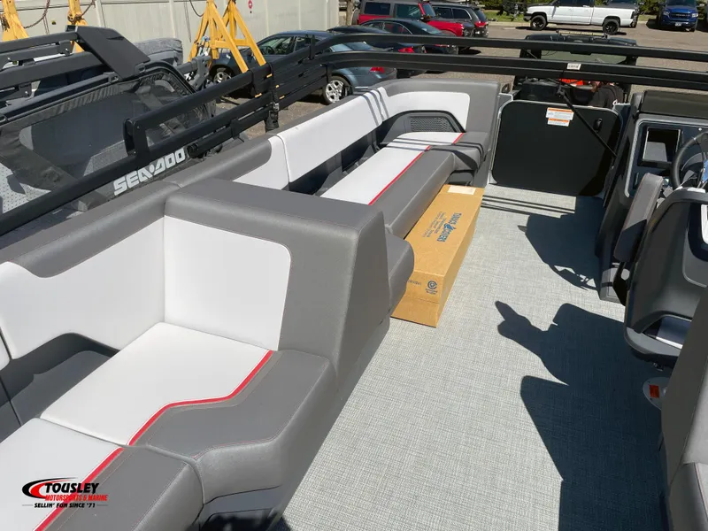 Slide: The Image of 2025 Manitou Cruise 20 MAX Bench Twin Tube interior with gray and white seating. - 7