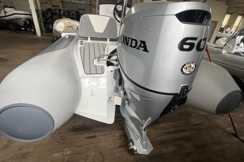 Slide: The Image of 2026 Gala V420 boat with Honda 60 outboard motor in a showroom. - 10