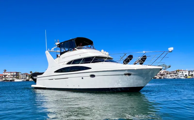 The Image of 2004 Carver 420 Mariner yacht cruising on clear blue water under a sunny sky. - 0