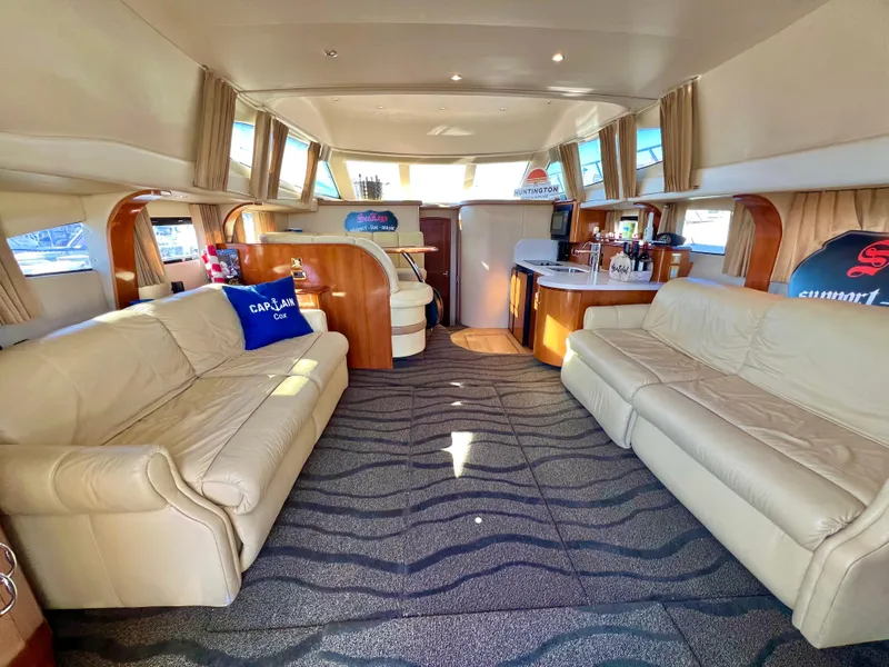 Slide: The Image of Luxurious interior of a 2004 Carver 420 Mariner yacht with plush seating and modern amenities. - 12
